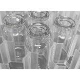 Open sterile ISO 6R clear vials in nested trays.